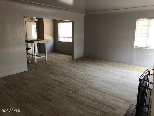 333 West Almeria Road Phoenix, AZ 85003 - Photo 2 of 14 an empty room with wooden floor and windows