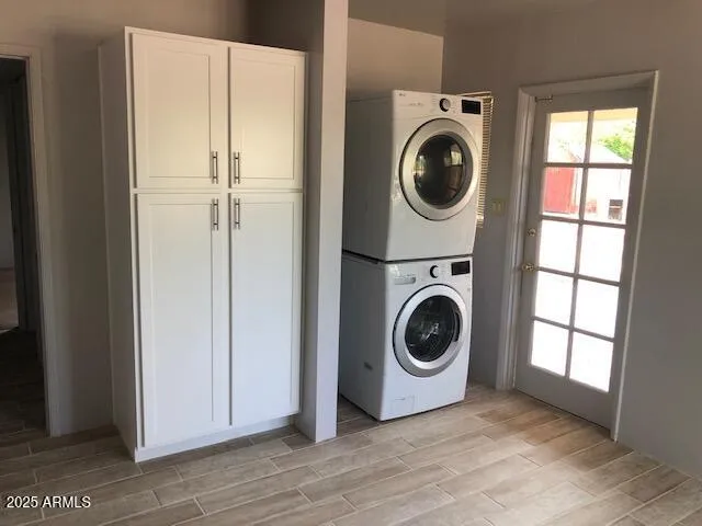 a view of a storage and utility room with washer and dryer