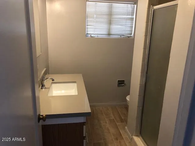 a bathroom with a sink and toilet