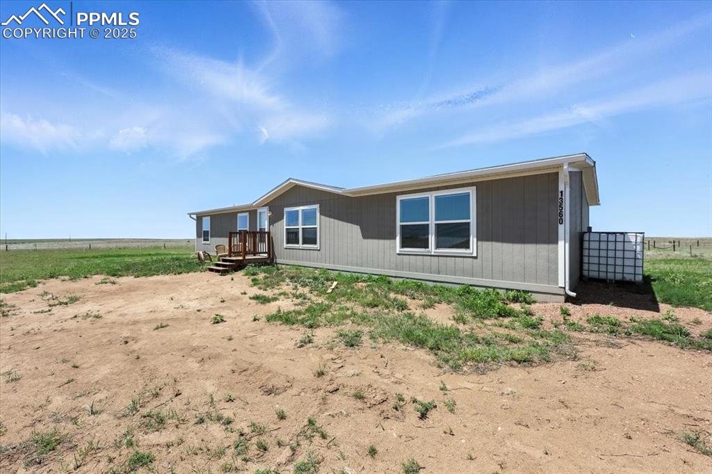 13560 Whittemore Road Yoder, CO 80864 - Photo 1 of 50 a house view with a backyard space