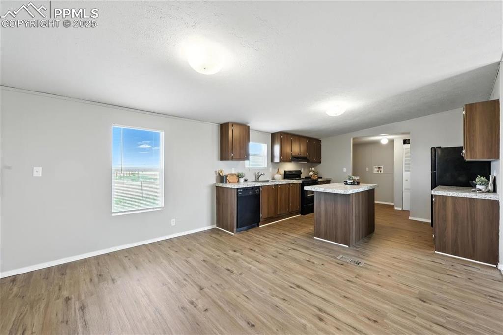 13560 Whittemore Road Yoder, CO 80864 - Photo 11 of 50 a view of kitchen with sink microwave and refrigerator