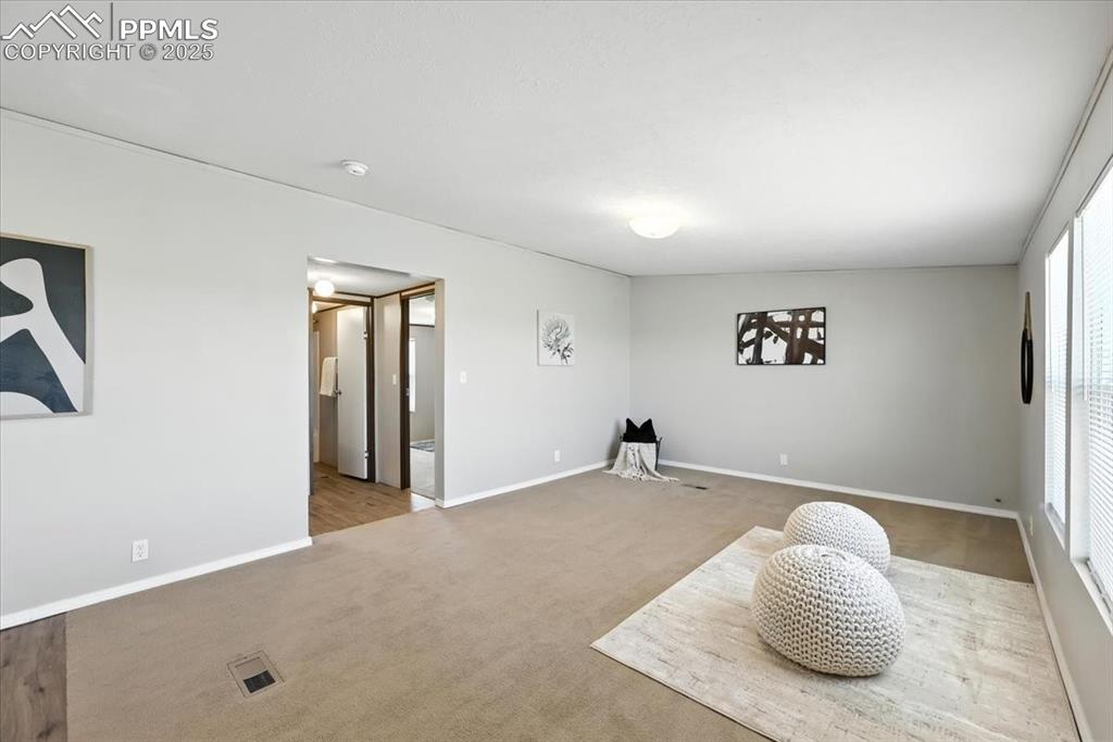 13560 Whittemore Road Yoder, CO 80864 - Photo 13 of 50 a bedroom with a bed and a chair