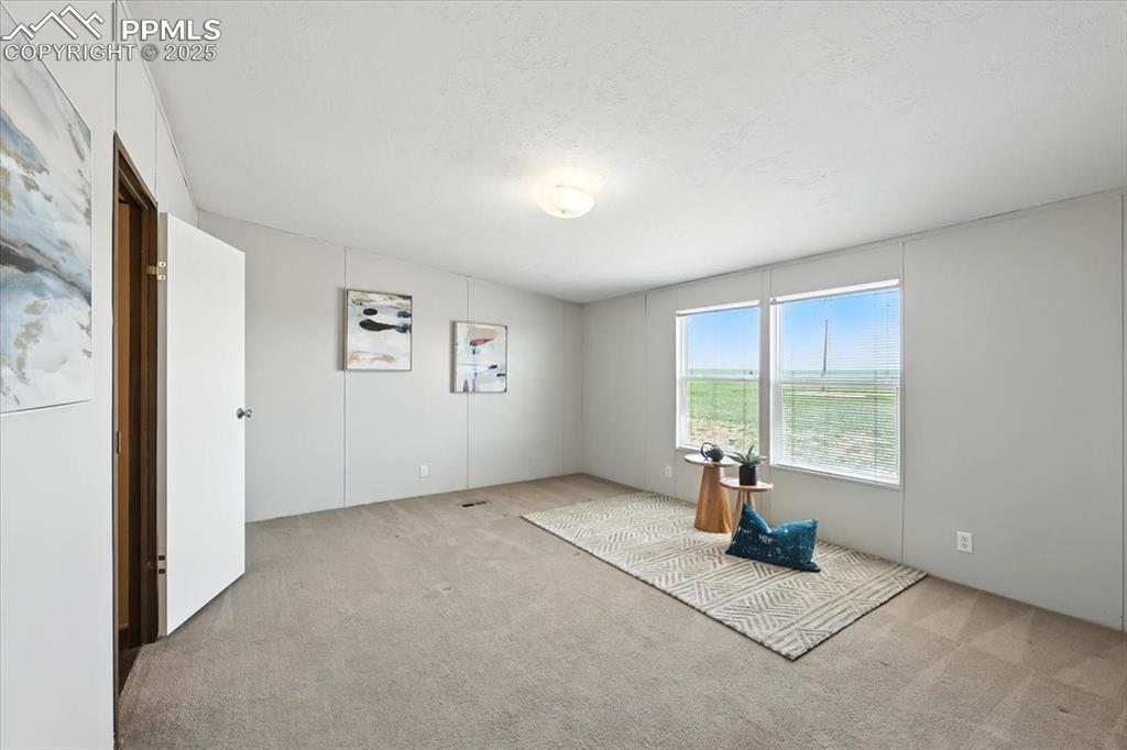 13560 Whittemore Road Yoder, CO 80864 - Photo 16 of 50 an empty room with windows