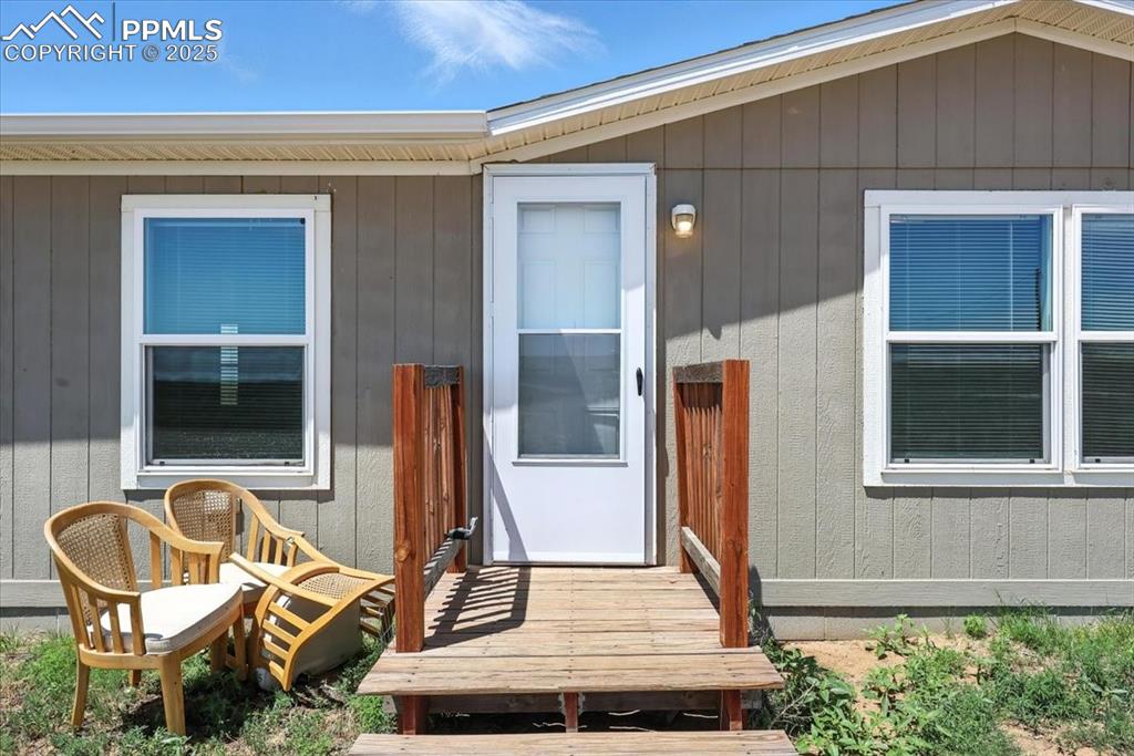 13560 Whittemore Road Yoder, CO 80864 - Photo 2 of 50 a view of a house with a patio