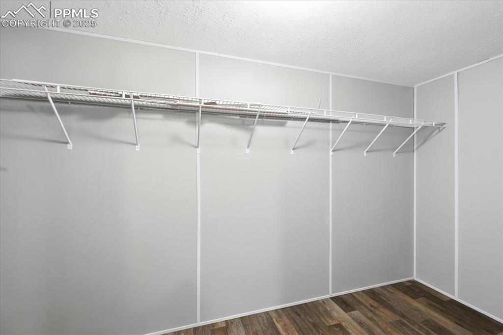 13560 Whittemore Road Yoder, CO 80864 - Photo 21 of 50 a view of walk in closet with empty racks