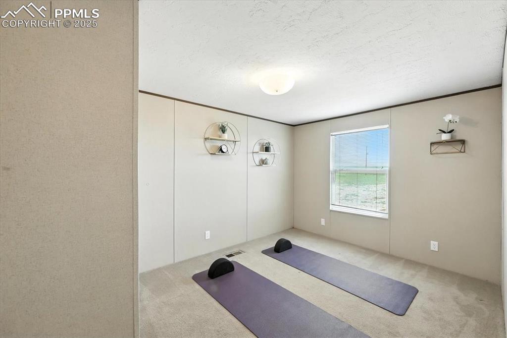 13560 Whittemore Road Yoder, CO 80864 - Photo 24 of 50 a bedroom with a bed and a window