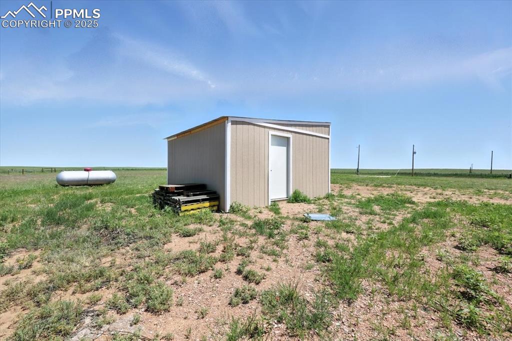 13560 Whittemore Road Yoder, CO 80864 - Photo 31 of 50 a backyard of a house