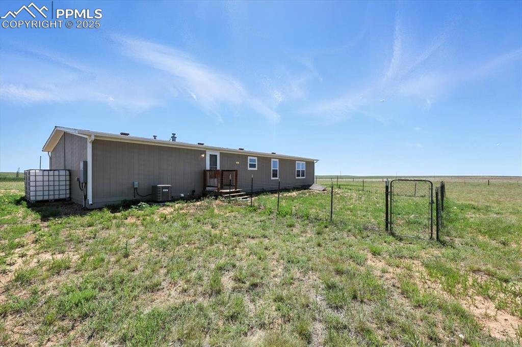13560 Whittemore Road Yoder, CO 80864 - Photo 32 of 50 a backyard of a house