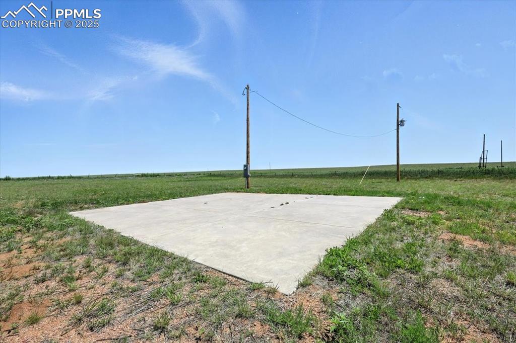 13560 Whittemore Road Yoder, CO 80864 - Photo 36 of 50 a white house with a yard