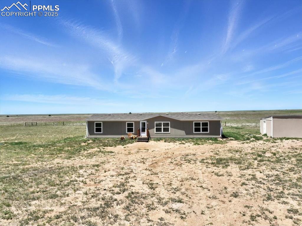 13560 Whittemore Road Yoder, CO 80864 - Photo 39 of 50 a view of house with yard