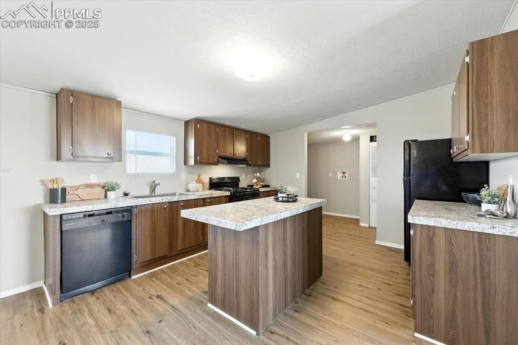 13560 Whittemore Road Yoder, CO 80864 - Photo 7 of 50 a kitchen with a sink stove and refrigerator