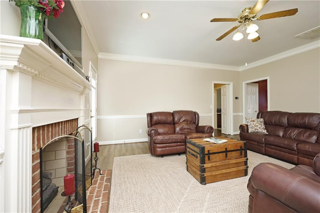 1670 Deep Creek Church Road Burlington, NC 27217 - Photo 11 of 36 a living room with furniture ceiling fan and a rug