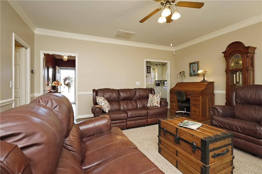 1670 Deep Creek Church Road Burlington, NC 27217 - Photo 12 of 36 a living room with furniture a ceiling fan and a window