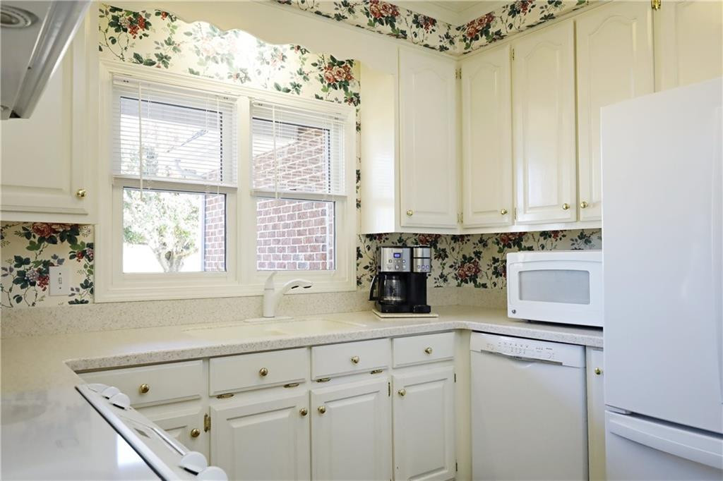 1670 Deep Creek Church Road Burlington, NC 27217 - Photo 14 of 36 a kitchen with a cabinets window and chairs