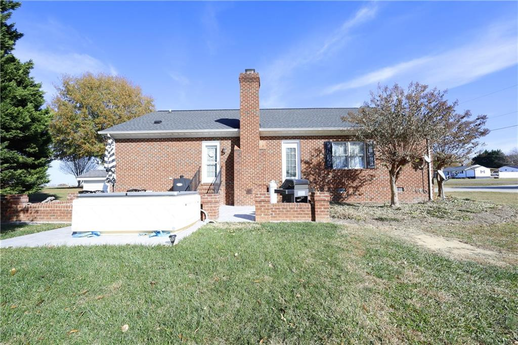 1670 Deep Creek Church Road Burlington, NC 27217 - Photo 28 of 36 a view of a house with a yard and sitting area