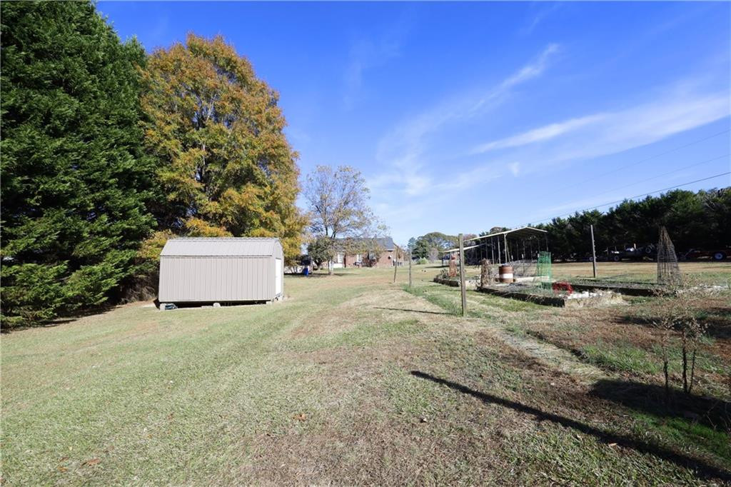 1670 Deep Creek Church Road Burlington, NC 27217 - Photo 30 of 36 a view of a yard with cars parked