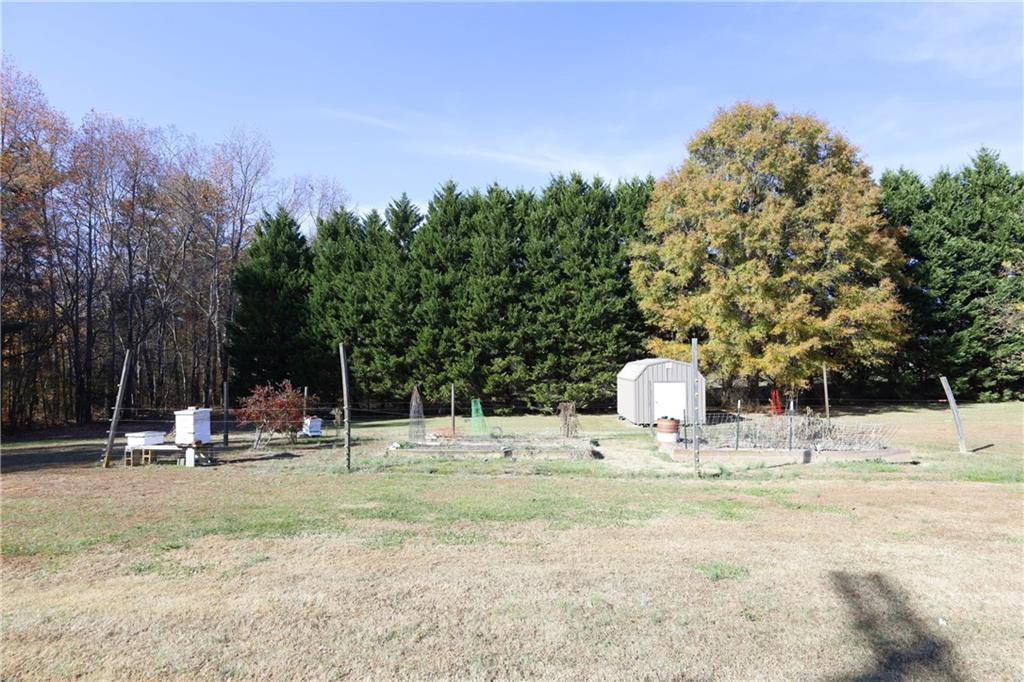 1670 Deep Creek Church Road Burlington, NC 27217 - Photo 31 of 36 a view of a playground with basketball court