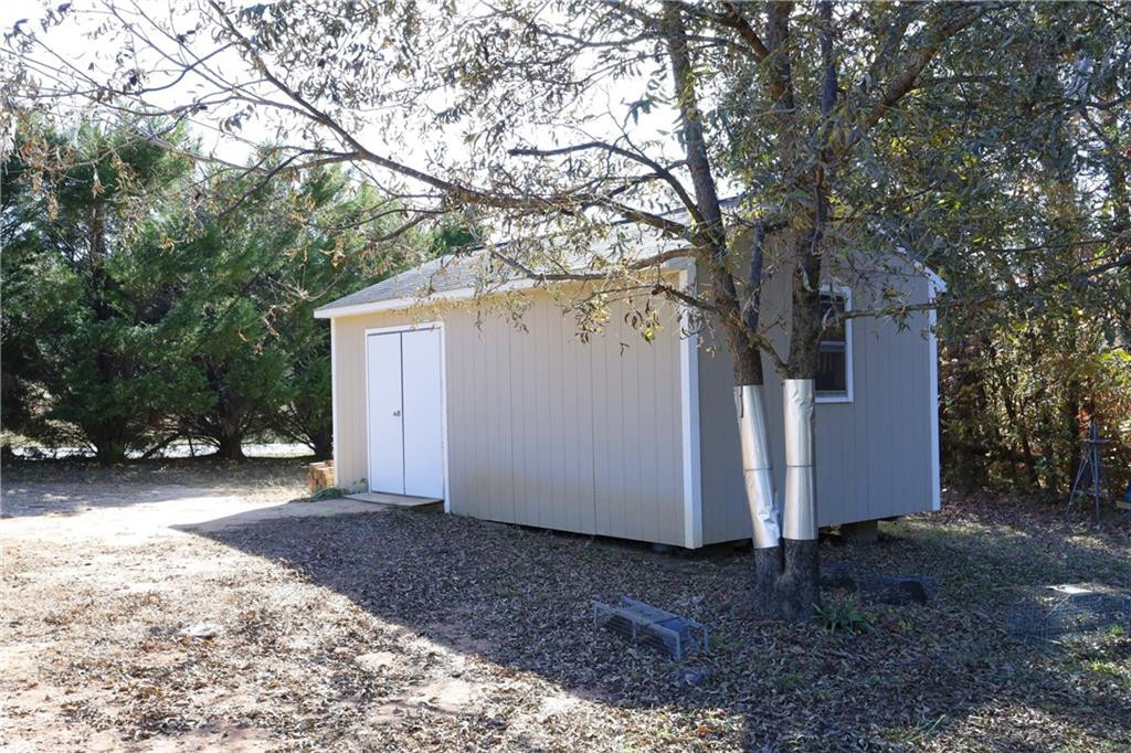 1670 Deep Creek Church Road Burlington, NC 27217 - Photo 33 of 36 a view of a house with a tree in the background