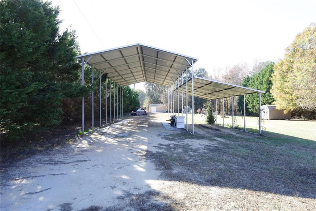 1670 Deep Creek Church Road Burlington, NC 27217 - Photo 36 of 36 a view of a house with backyard and sitting area