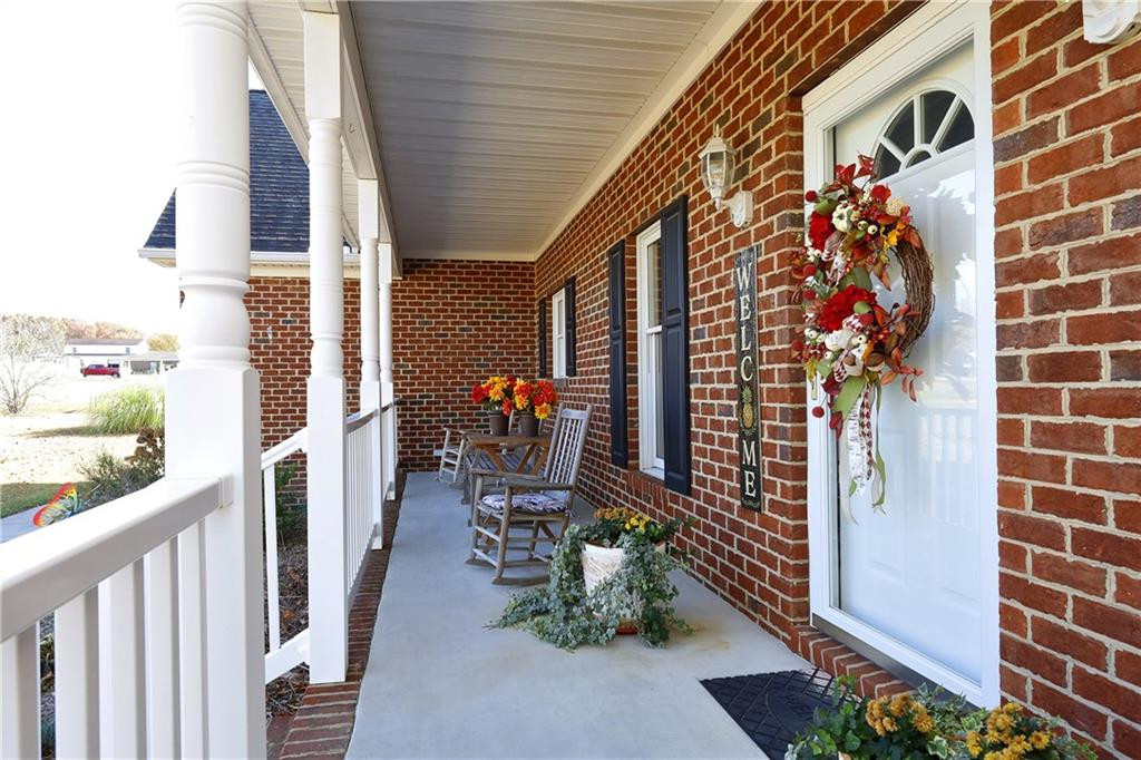 1670 Deep Creek Church Road Burlington, NC 27217 - Photo 5 of 36 a backyard of a house with outdoor seating