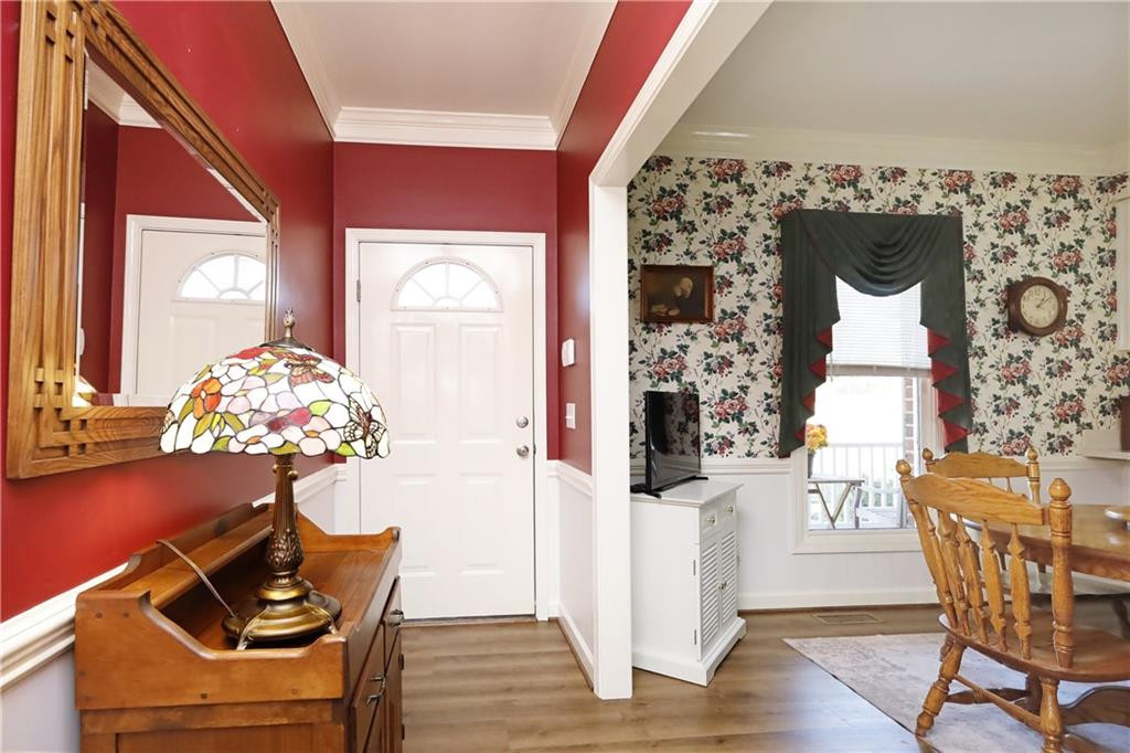 1670 Deep Creek Church Road Burlington, NC 27217 - Photo 6 of 36 a dining room with furniture and wooden floor