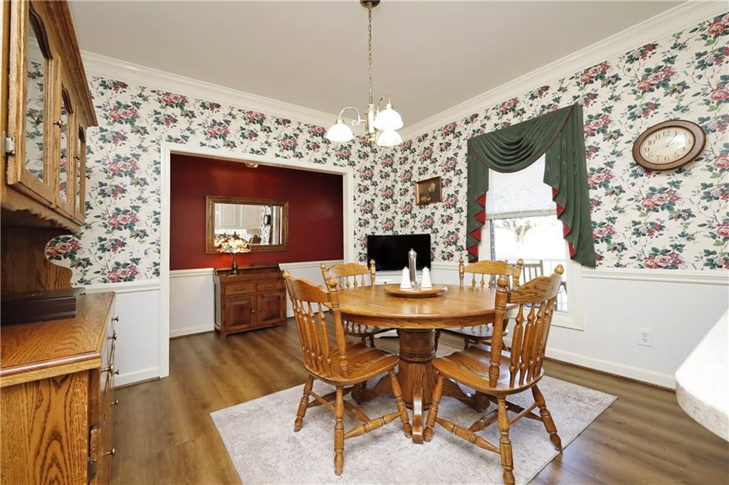 1670 Deep Creek Church Road Burlington, NC 27217 - Photo 7 of 36 a view of a dining room with furniture and wooden floor