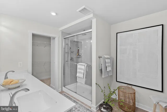 a bathroom with a tub sink and shower