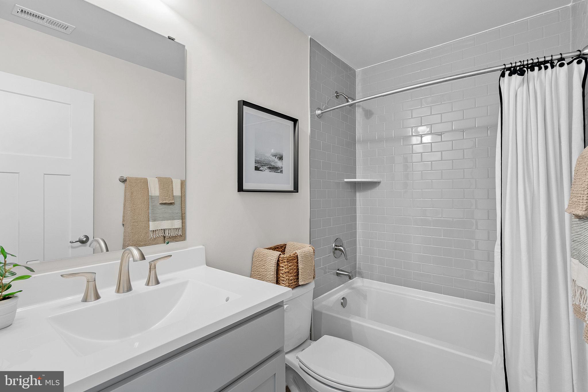 23 Elmiraj Court Inwood, WV 25428 - Photo 19 of 26 a bathroom with a sink toilet and shower