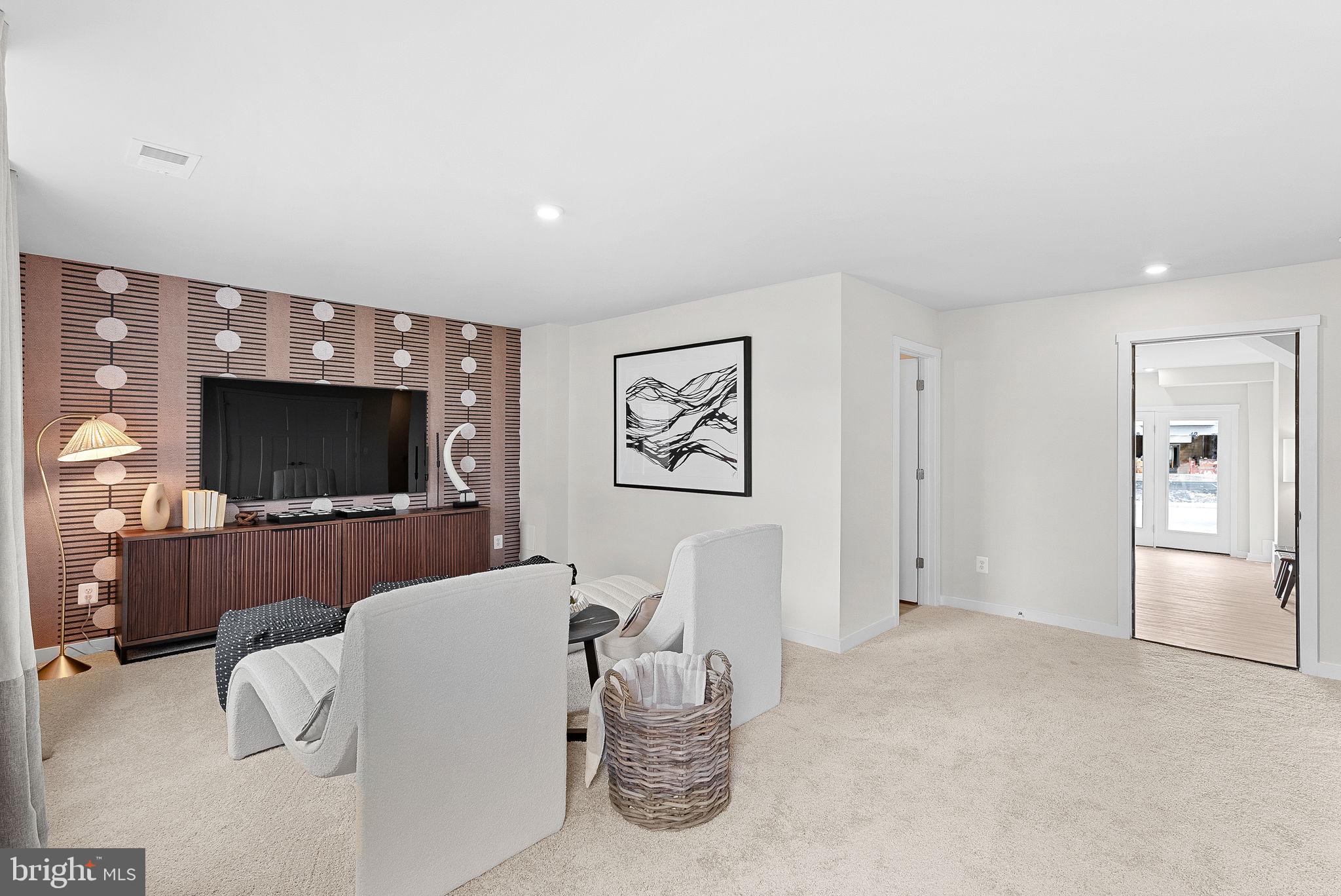 23 Elmiraj Court Inwood, WV 25428 - Photo 23 of 26 a living room with furniture and a flat screen tv