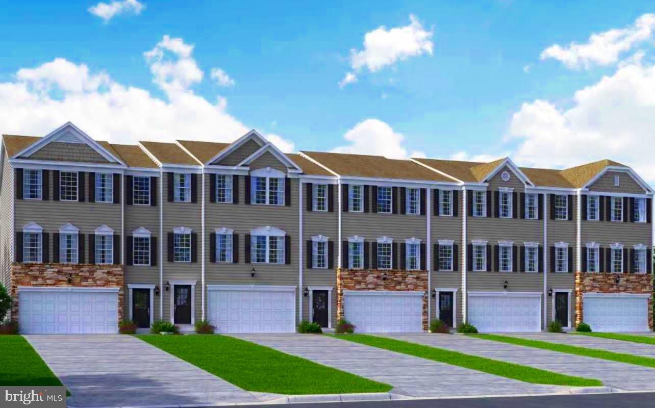 23 Elmiraj Court Inwood, WV 25428 - Photo 5 of 26 a front view of a house with a yard