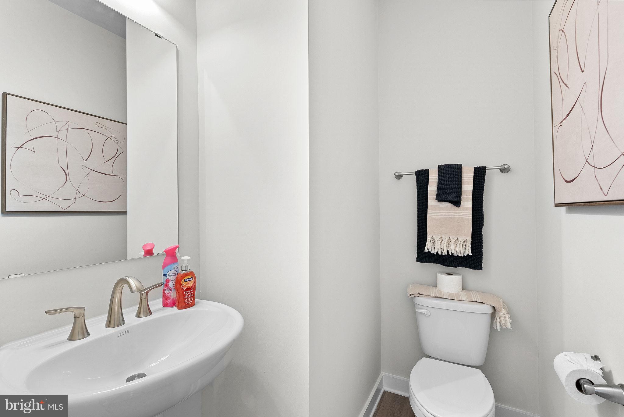 23 Elmiraj Court Inwood, WV 25428 - Photo 9 of 26 a bathroom with a toilet sink and mirror