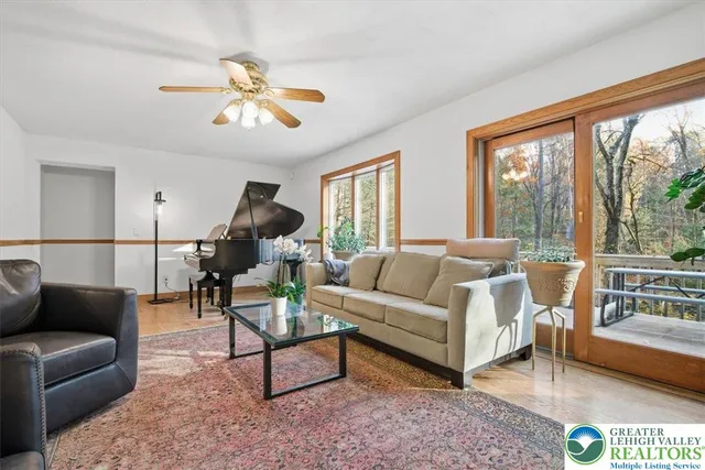 a bedroom with a large bed and a large window