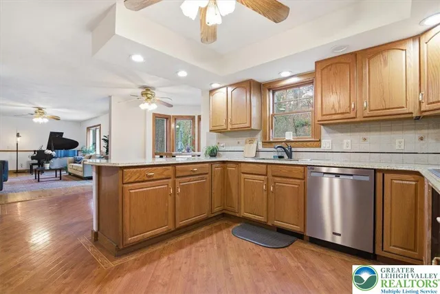 a spacious bedroom with a bed and a window