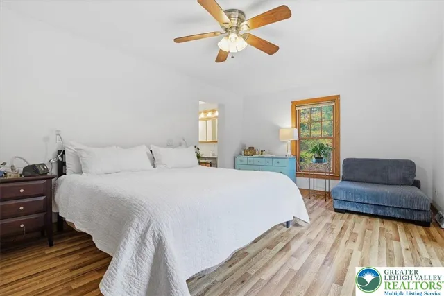 a bathroom with a toilet and a shower curtain