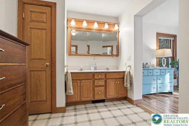 a bathroom with a sink and a mirror