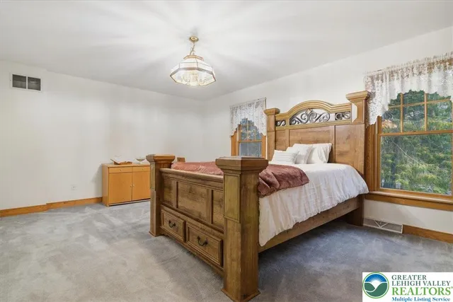 a kitchen with stainless steel appliances granite countertop a stove and a microwave