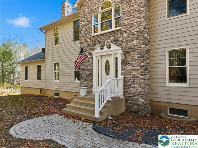a workspace with wooden floor and a window