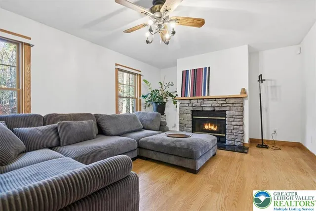 a kitchen with stainless steel appliances granite countertop a refrigerator a sink and white cabinets