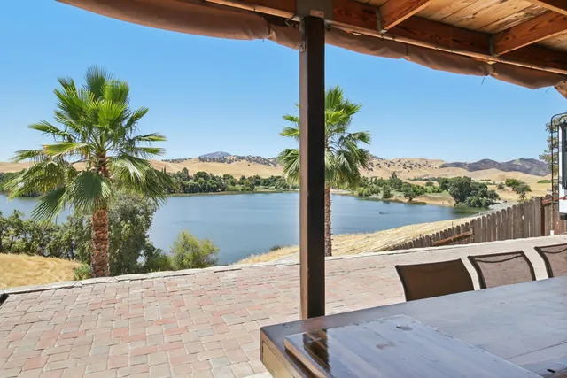 an aerial view of a house with a lake view