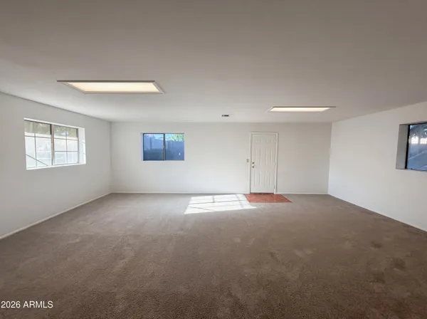a view of an empty room with a window