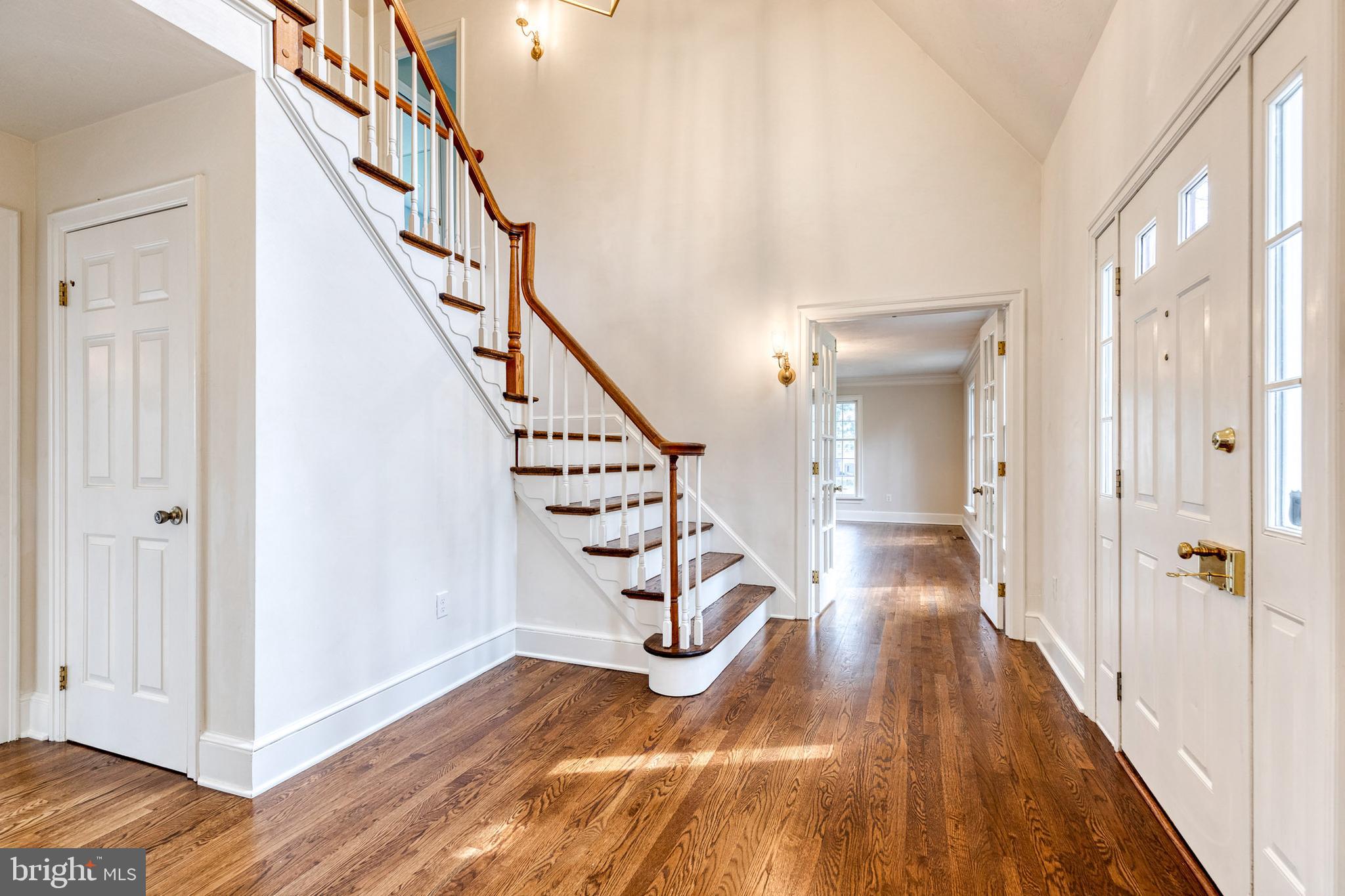 1216 Bonaire Road Forest Hill, MD 21050 - Photo 5 of 71 a view of a hallway with wooden floor and staircase