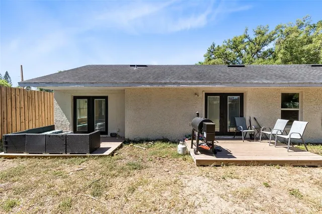a view of swimming pool with outdoor seating