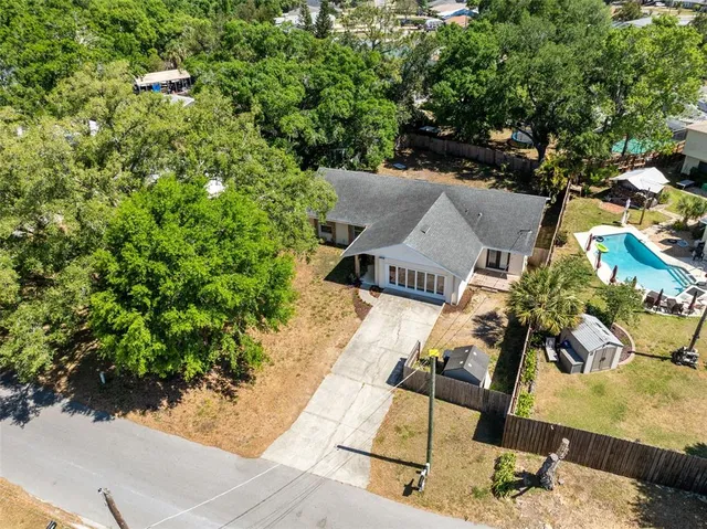 an aerial view of residential house with outdoor space