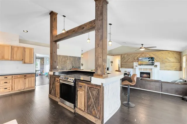 a kitchen with stainless steel appliances and white cabinets