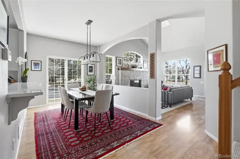 a living room with furniture a table and a chandelier