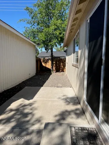 a view of a backyard of the house