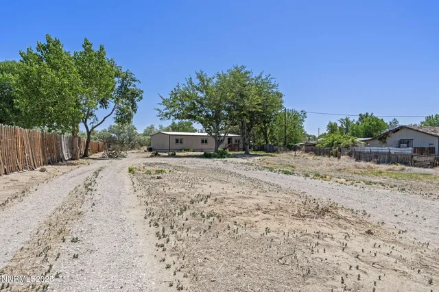 a view of street with large trees