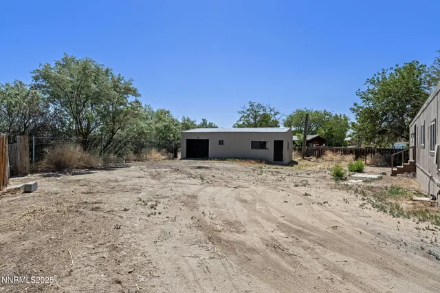 a house with trees in the background