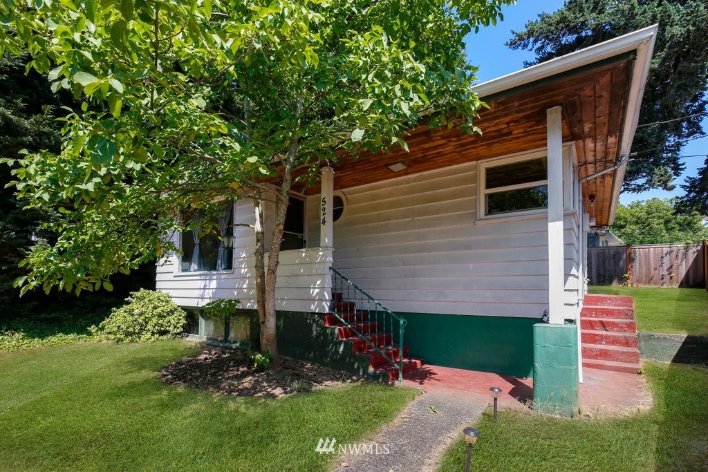 524 Southwest Sunset Boulevard Renton, WA 98057 - Photo 1 of 22 a view of front of house with a yard