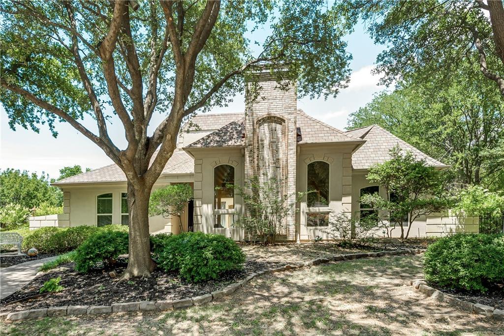 1450 Meandering Way Rockwall, TX 75087 - Photo 1 of 1 a front view of a house with garden